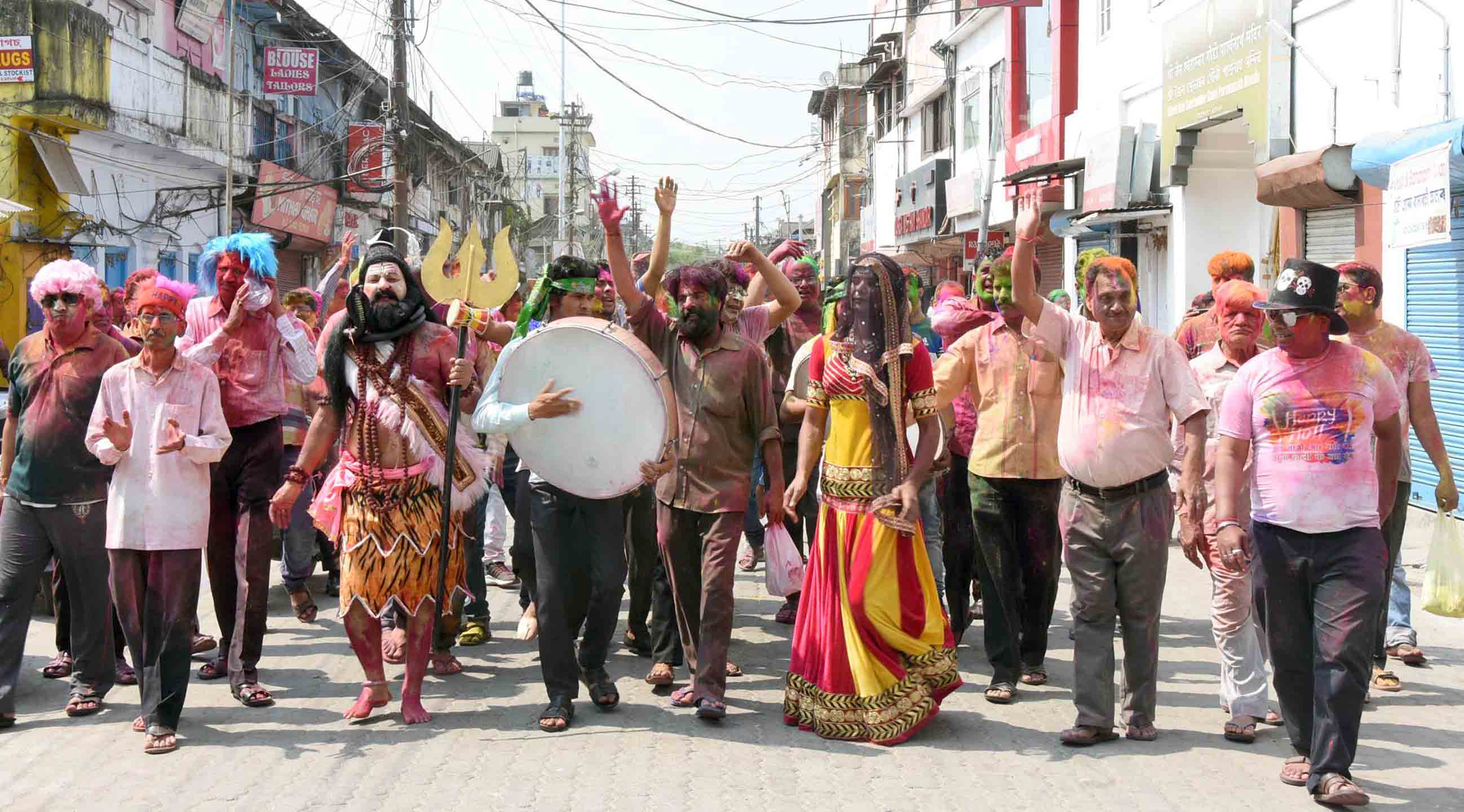 A man dresses up as a Lord Shiva during Holi celebration