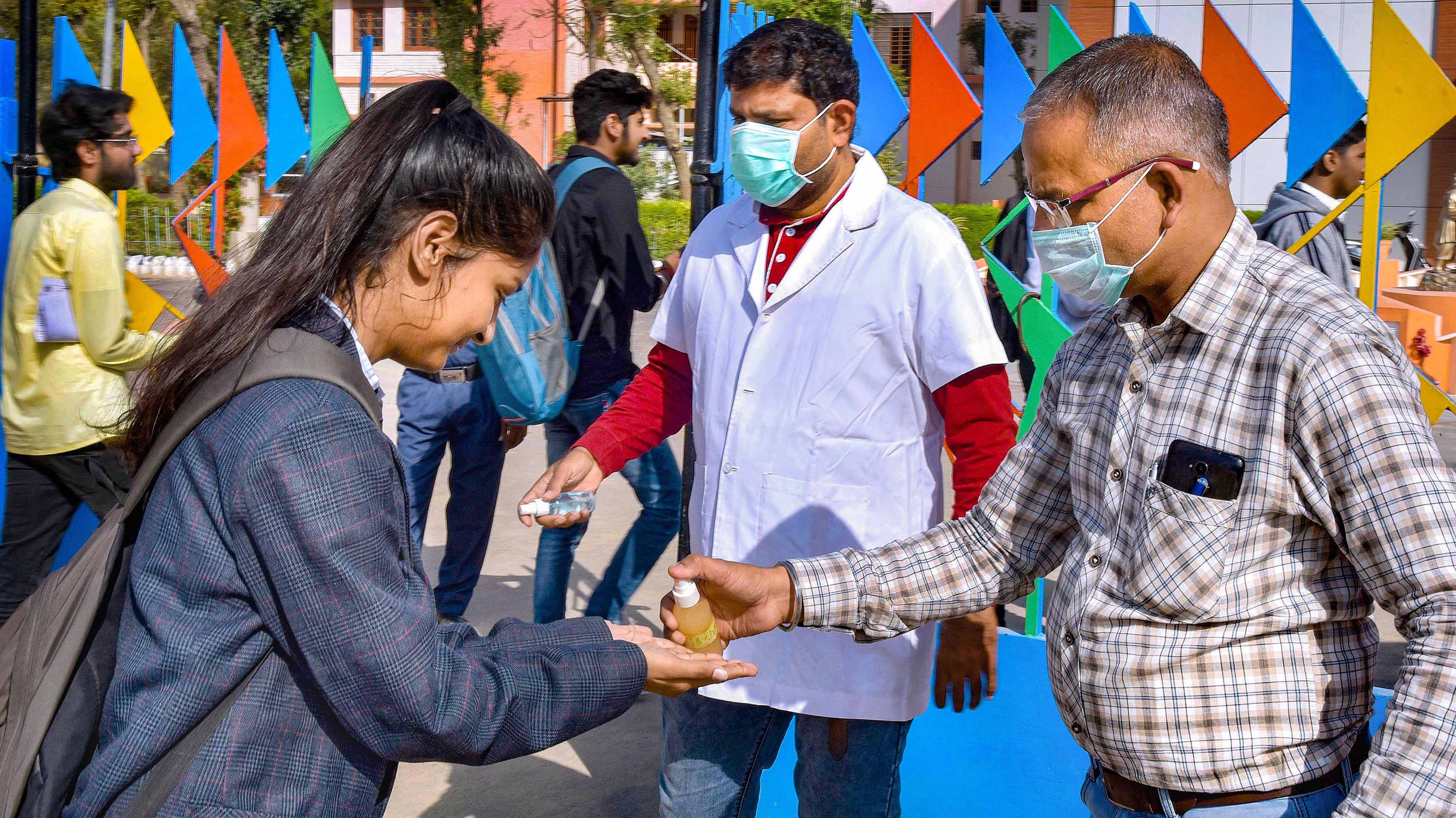 Students sanitize their hands amid coronavirus fears