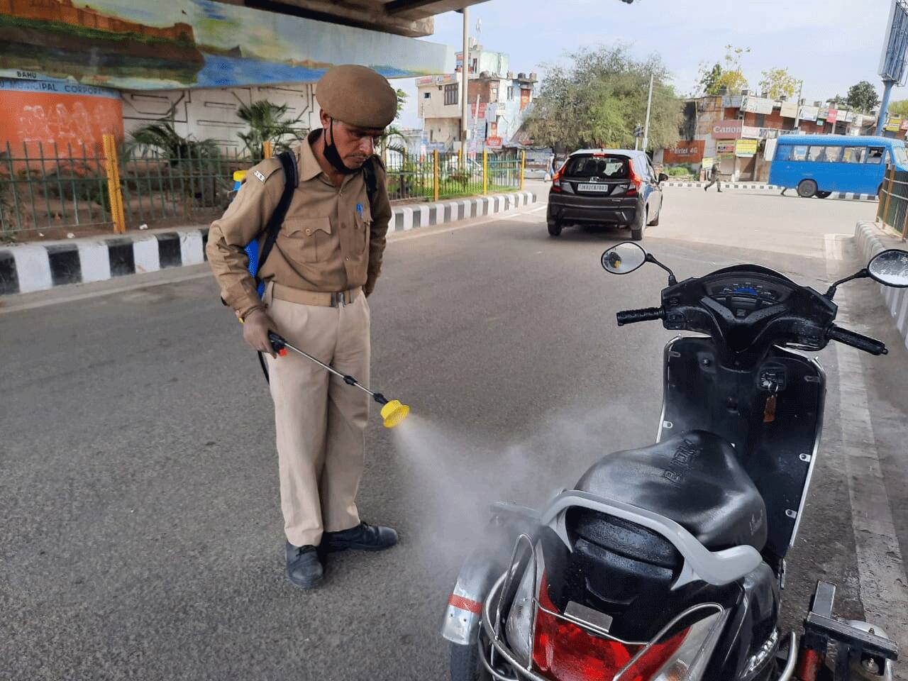 Gaziabad police sanitize vehicles on road 