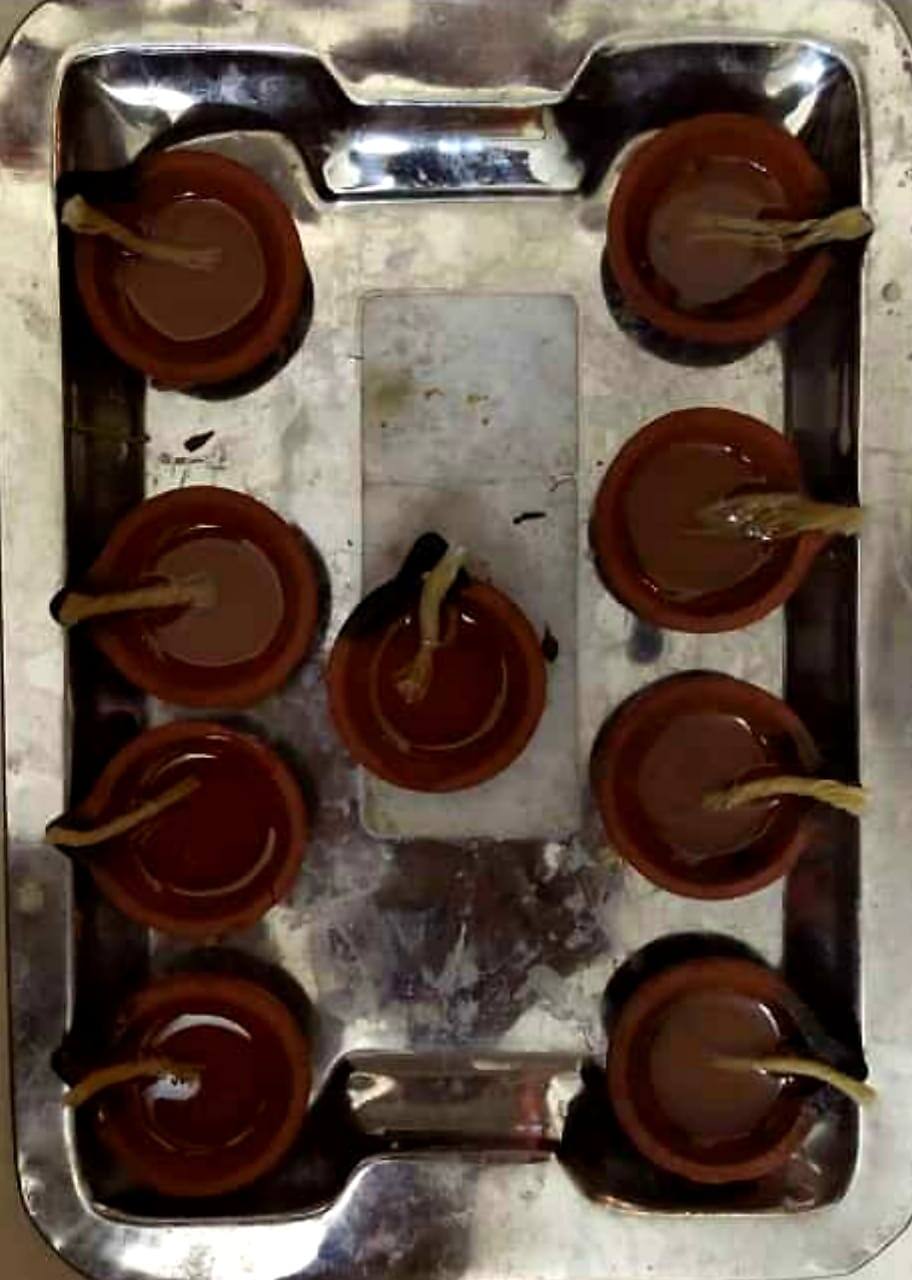 People prepare their diyas