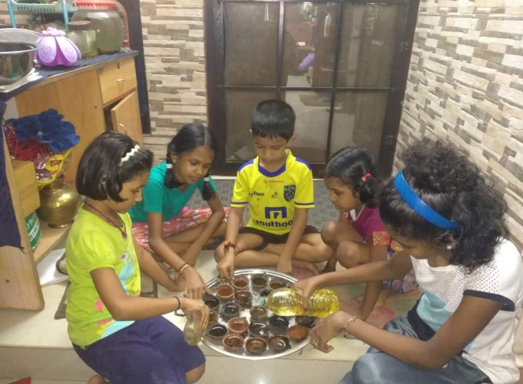 Kids preparing their diyas