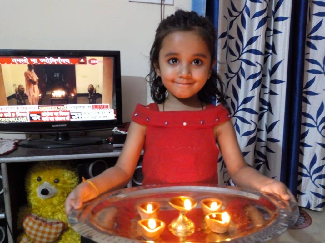 Kid with diyas