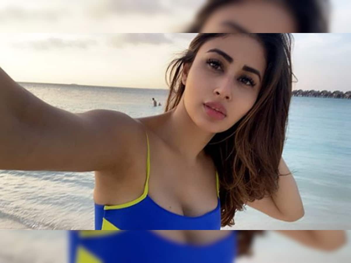 Mouni Roy poses in an electric blue bikini, flaunts her beach body in these pics! | People News | Zee News