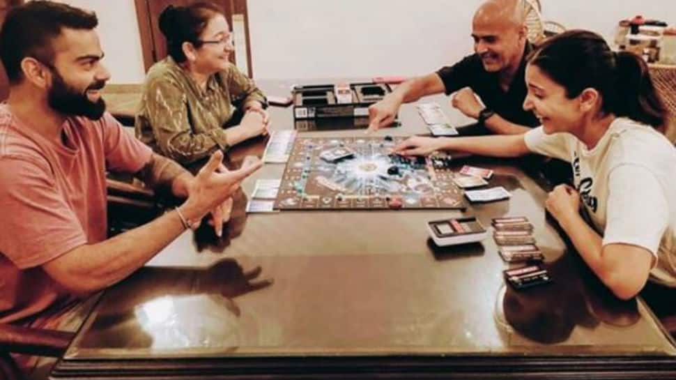 Pic of Anushka Sharma and Virat Kohli playing monopoly with her parents is making us miss our family even more