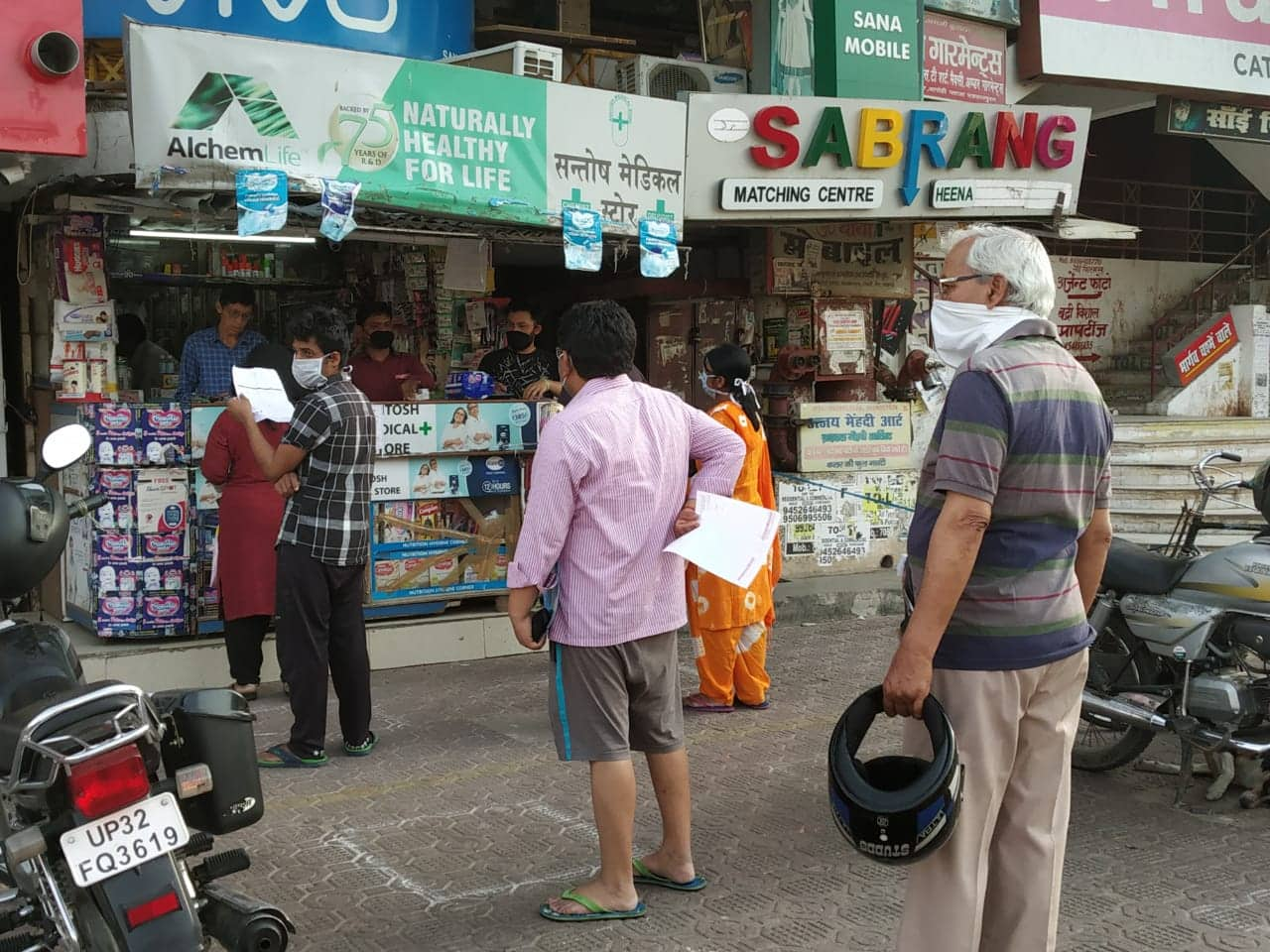 People line up to buy medicines