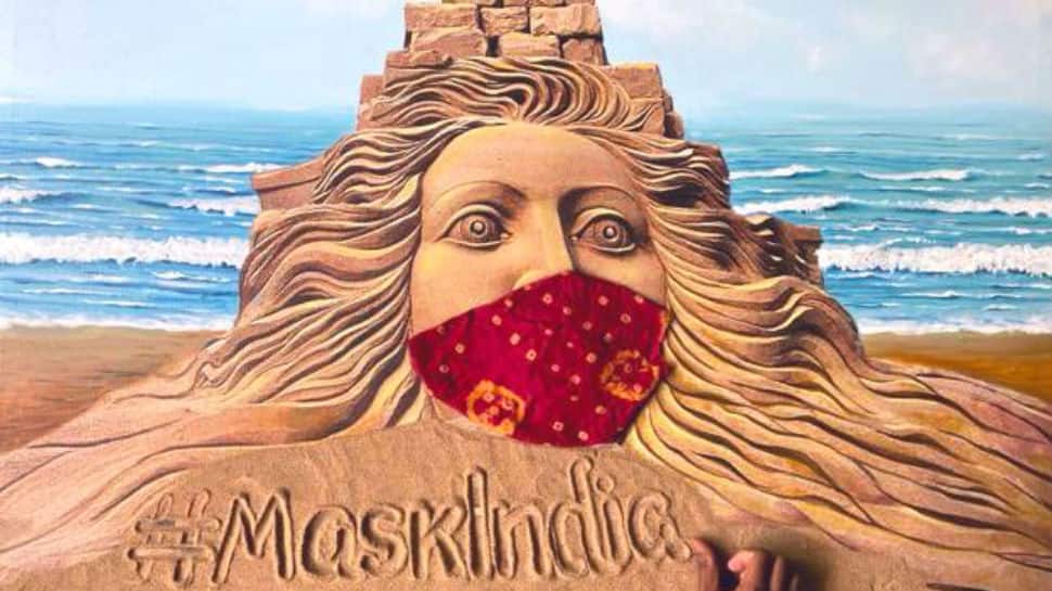 Sand artist Sudarsan Pattnaik urges people to make masks at home through his breathtaking creation