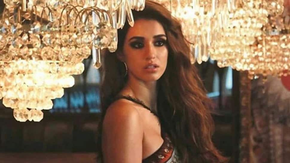 Disha Patani dolls-up in a corset top, denims and boots only to sit in her living room - Pic proof