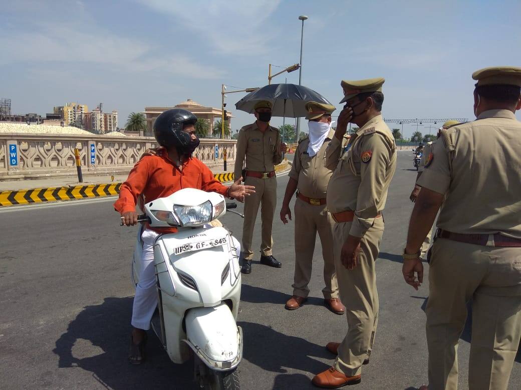 Police stop vehicles for an enquiry amid lockdown