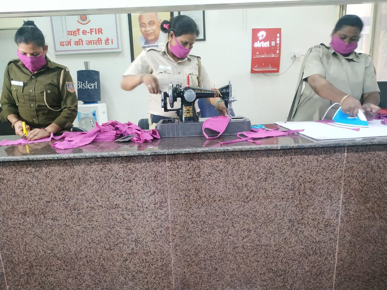 Delhi police women personnel making face masks