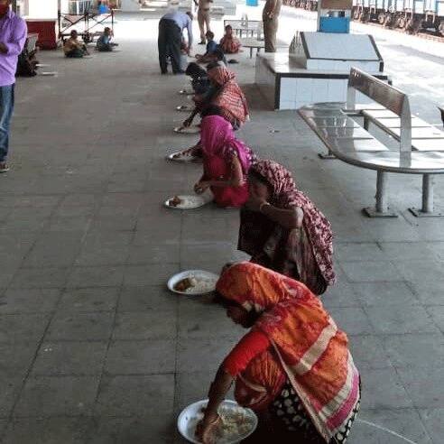 Needy people being served food 