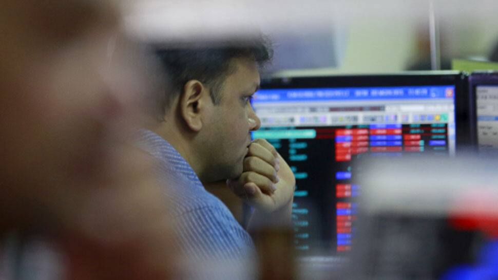 Sensex jumps nearly 1100 points mid-session, Nifty at 9,870