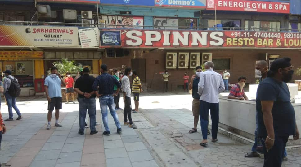 Delhi liquor shops open, thousands throng to buy, police called in