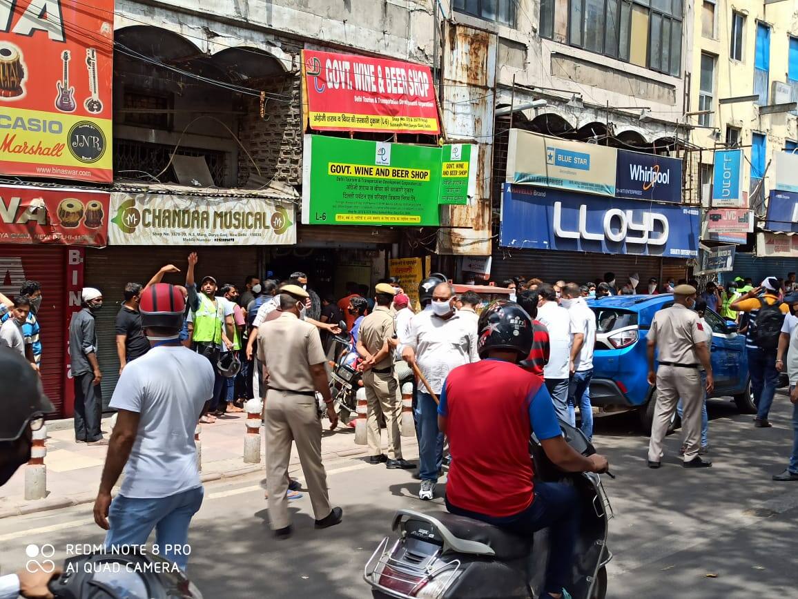 Long queues of people to purchase liquor