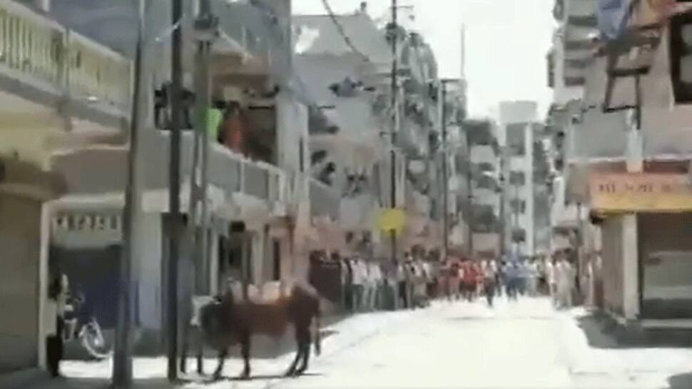 Hundreds of migrants resort to violence with police in Surat; tear gas shells fired