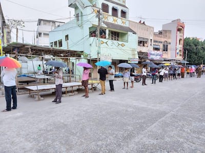 People waiting for their turn to buy alcohol in Andhra Pradesh