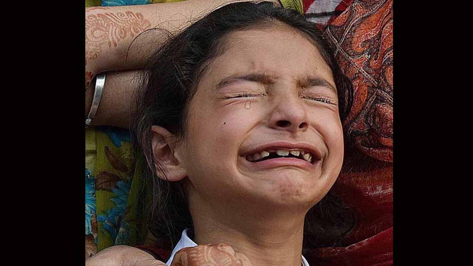 J&amp;K top cop slams Pulitzer winners, tweets picture of grieving daughter of martyred police officer