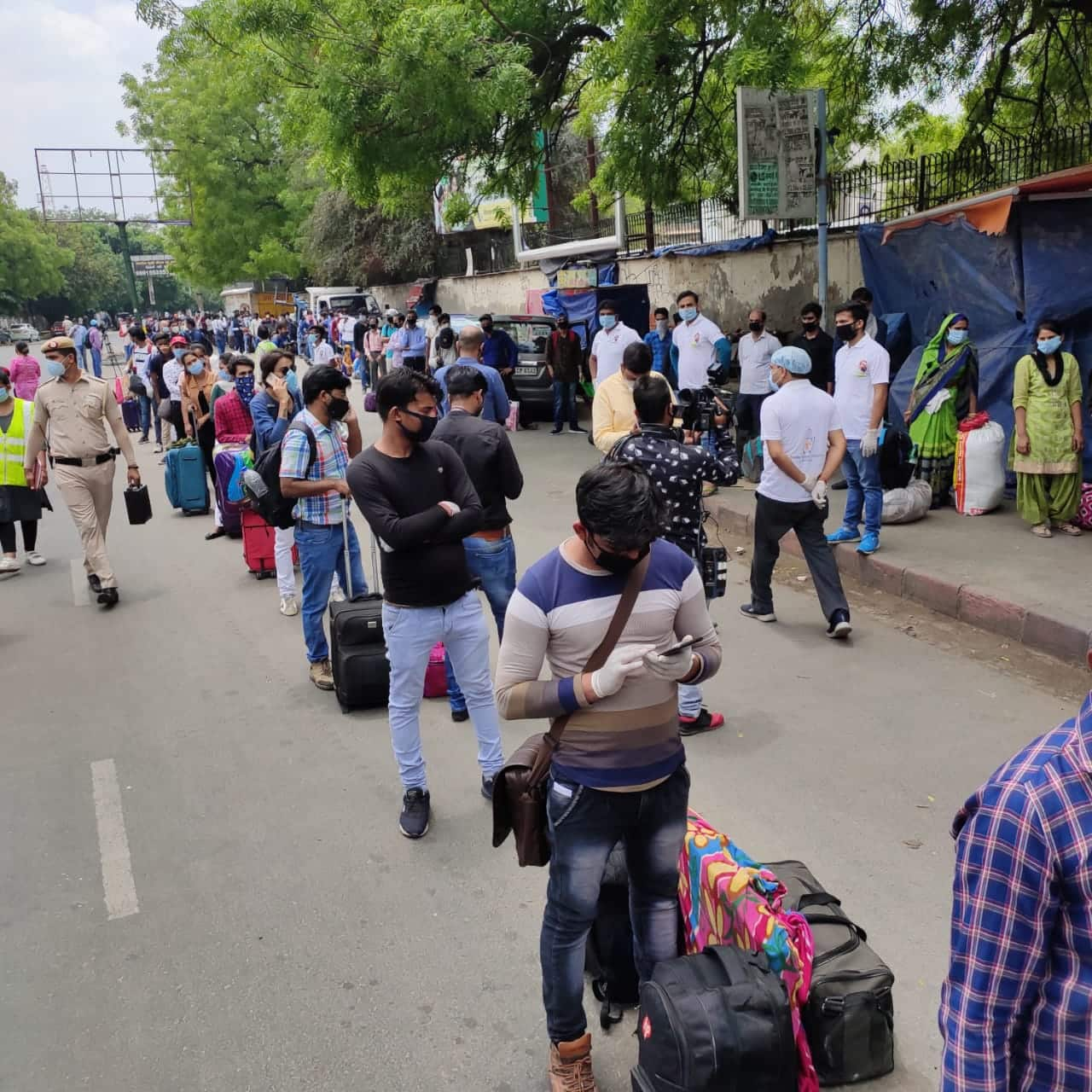 People waiting to enter New Delhi Railway Station