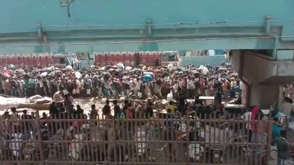 Migrant workers gather near Bandra station in Mumbai to board Shramik Special train, stopped – Watch