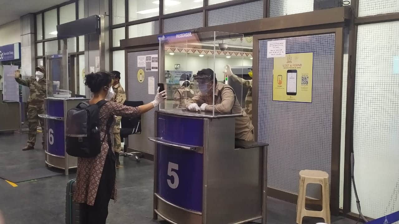 A passenger being screened for COVID-19 on her arrival