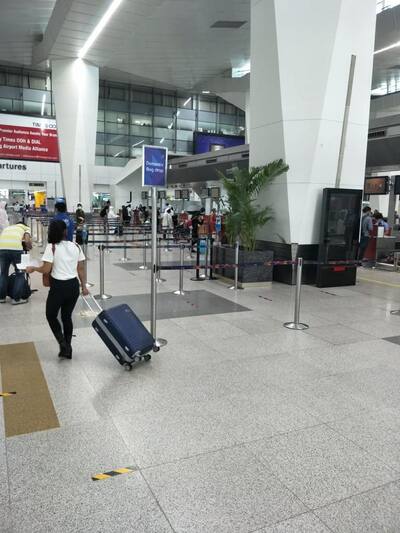 Passengers reaching Delhi airport to board flight