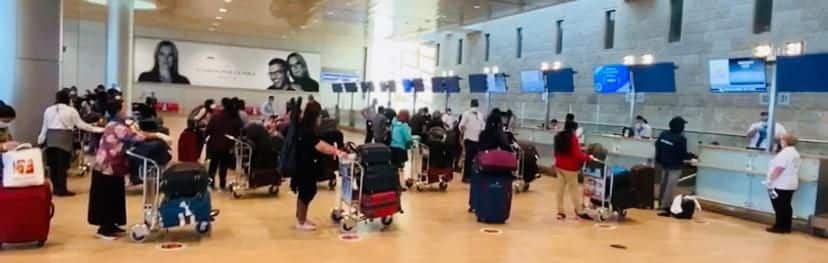 Passengers follow social distancing at airport