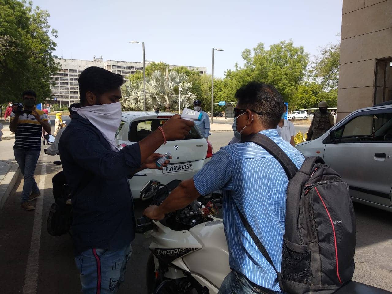 A Govt employee getting screened before entering office premises