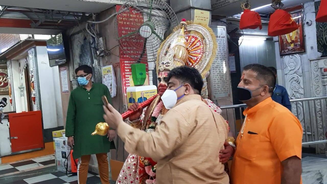 Devotees visit temple and click selfies with man dressed as Hanuman