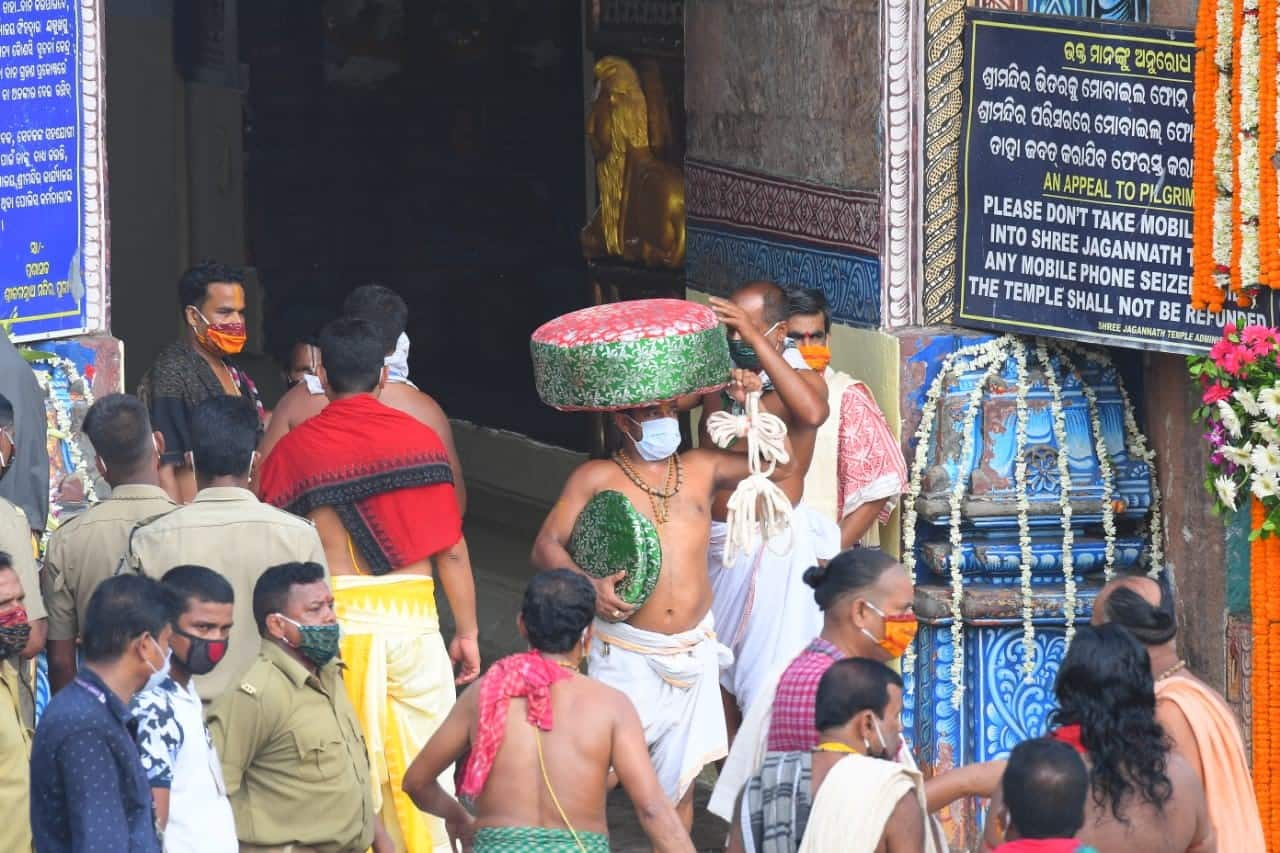 Devotees with masks