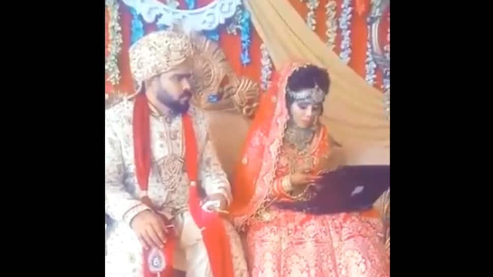 This bride&#039;s &#039;Work from Home&#039; continues at her wedding, groom sits clueless in this viral video breaking internet - Watch