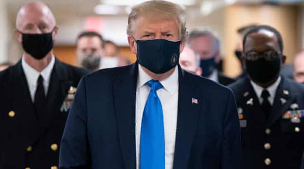 In a first, US President Donald Trump wears mask during visit to wounded service members