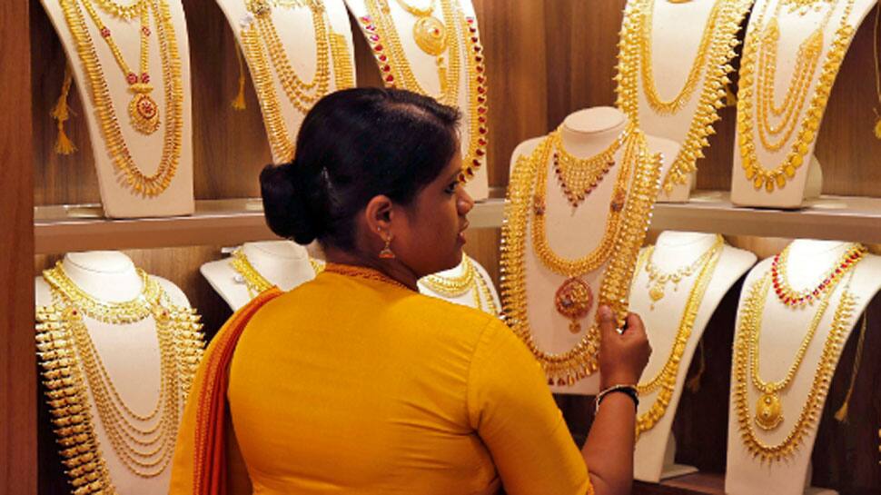 Gold falls by Rs 32 to Rs 49,986 per 10 gram