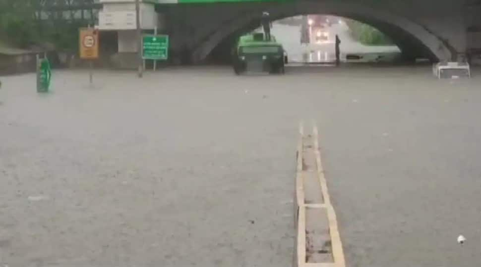 DTC bus gets stuck in waterlogged road in Delhi, passengers rescued by DFS personnel - Watch