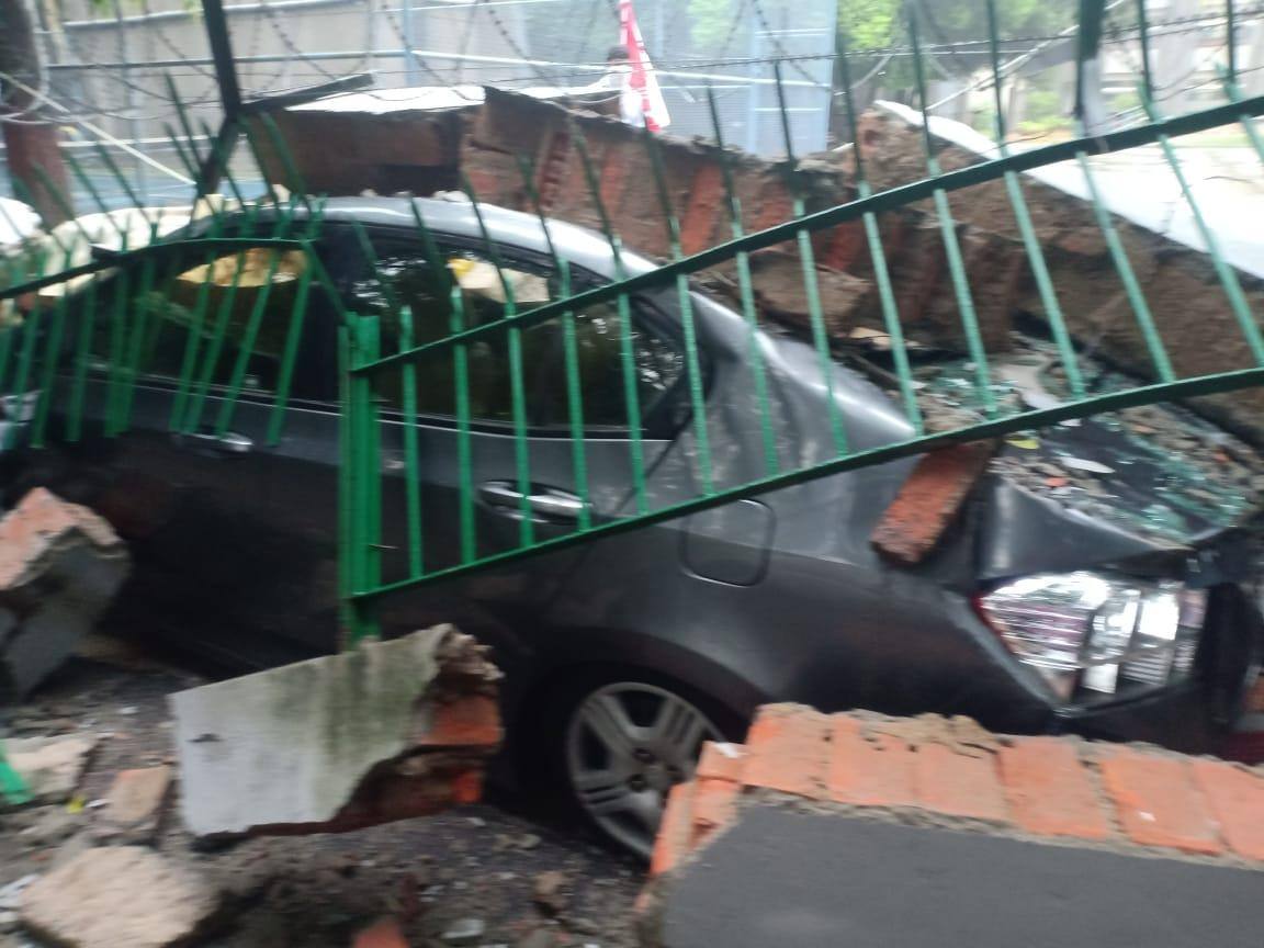 Wall along with its fence fell on Honda City