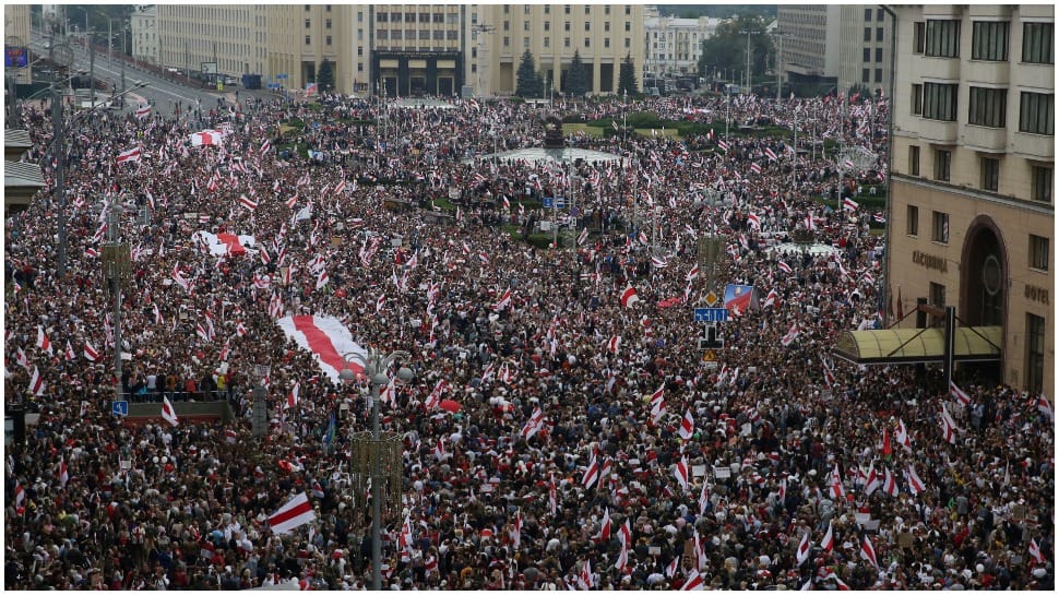 Protesters flood into Minsk as army issues warning amid Belarus political crisis