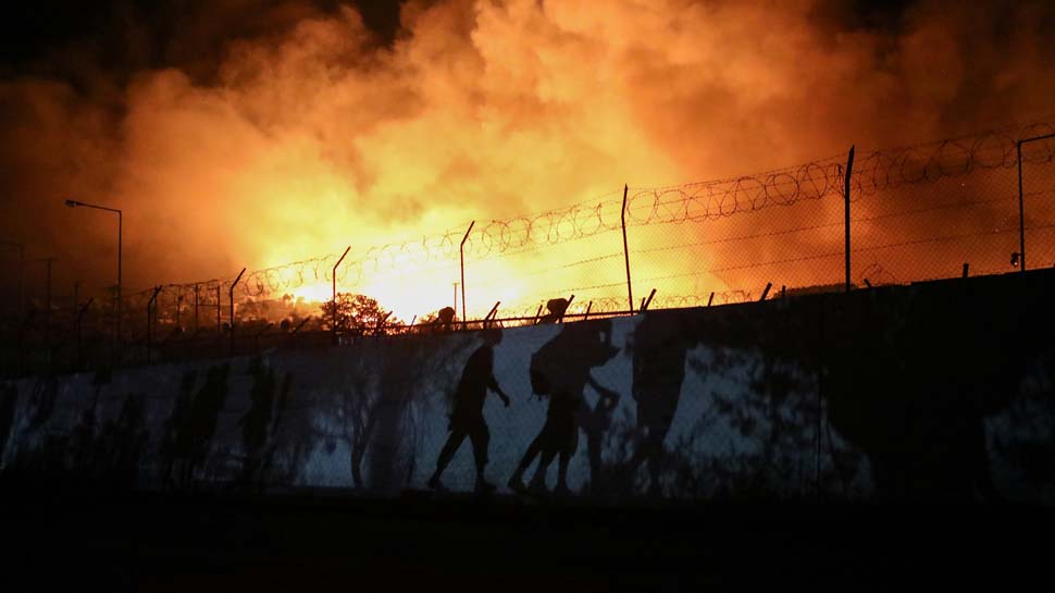 Thousands homeless after fire guts migrant camp on Greek island