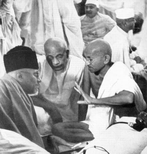 Mahatama Gandhi in a conference with Maulana Azad and Sardar Patel