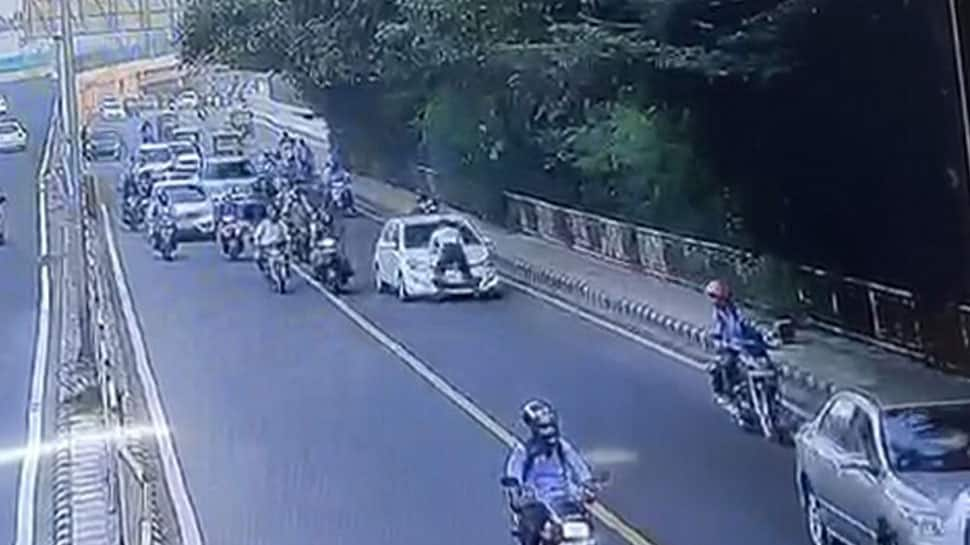 Delhi traffic policeman dragged on car bonnet for a few metres, driver arrested - WATCH