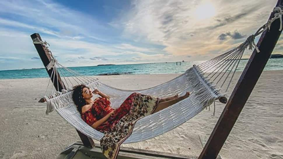 Taapsee Pannu chills on the white sand beach, wearing striped bikini and yes she&#039;s dreaming about Maldives!