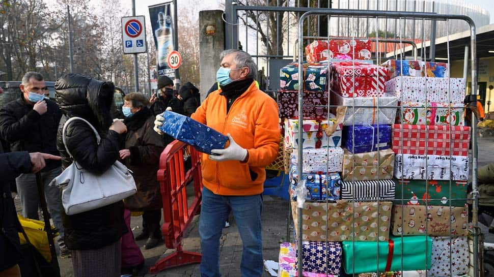 Queues form outside Italy&#039;s Milan food banks as crisis bites ahead of Christmas