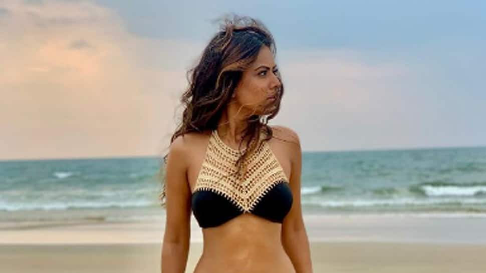 Naagin actress Nia Sharma oozes oomph in a black and golden bikini, steams up social media!