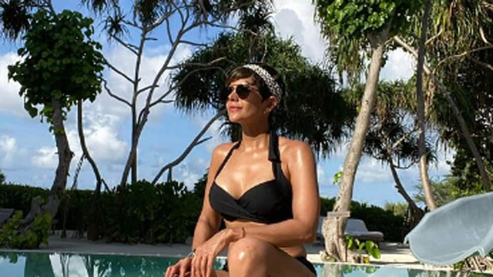 Mandira Bedi flaunts her washboard abs in throwback bikini pic; misses sun, sea and sand!