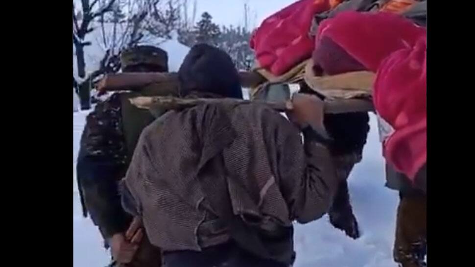 Indian Army personnel carry pregnant Kashmiri woman in knee-deep snow to hospital - Watch