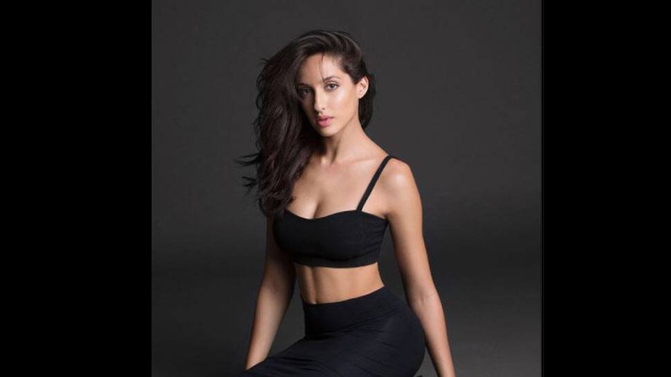 Nora Fatehi makes heads turn in crop top and biker shorts with beautiful  makeup for outing in Mumbai: All pics, video