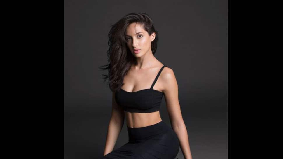 Nora Fatehi makes heads turn in crop top and biker shorts with beautiful  makeup for outing in Mumbai: All pics, video