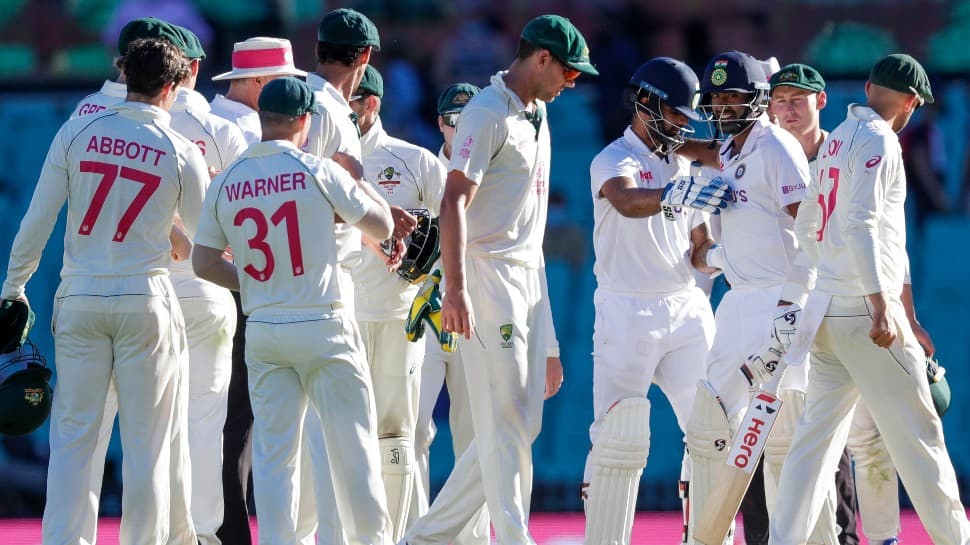 Ravichandran Ashwin and Hanuma Vihari (centre) are congratulated by Australian team after the draw.