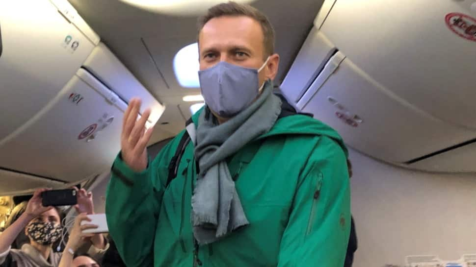 Kremlin critic Alexei Navalny lands in Russia, flying home despite arrest threat