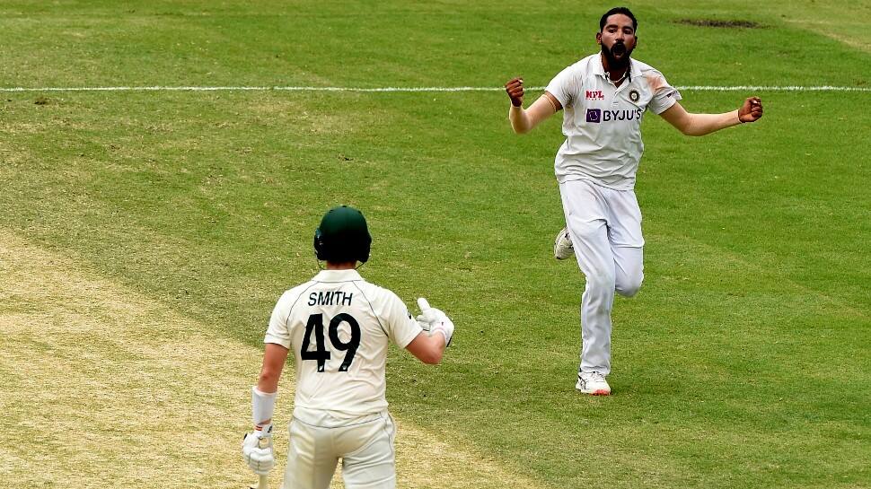 Mohammed Siraj (right) celebrates after dismissing in-form Steve Smith in the second innings of the Gabba Test. (Source: Twitter)