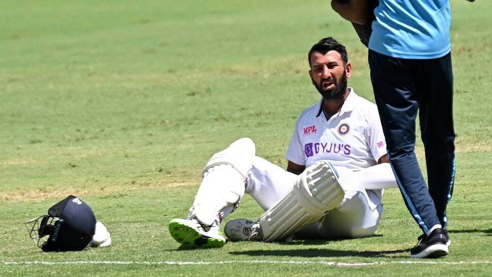 Cheteshwar Pujara is treated by Indian physio Nitin Patel after taking a blow on his body. (Source: Twitter)