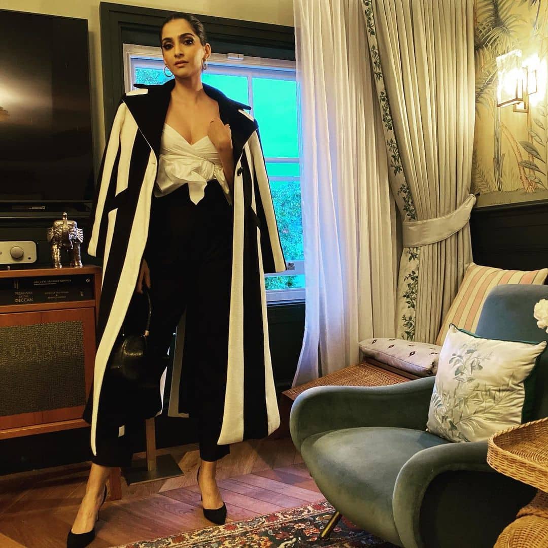 Sonam throws on a gorgeous evening coat for her girls night out