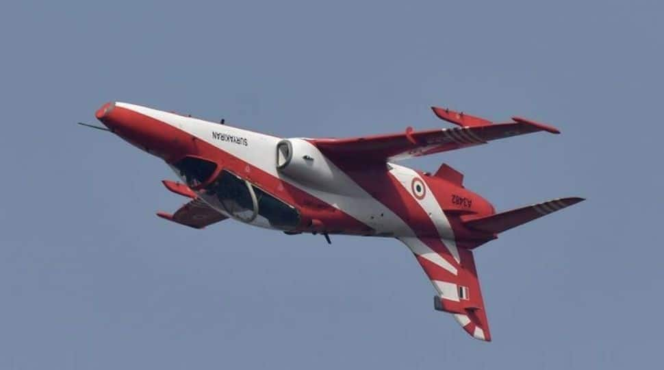 Indian Air Force's aircraft from Surya Kiran aerobatic team performing a flip stunt at the air show.